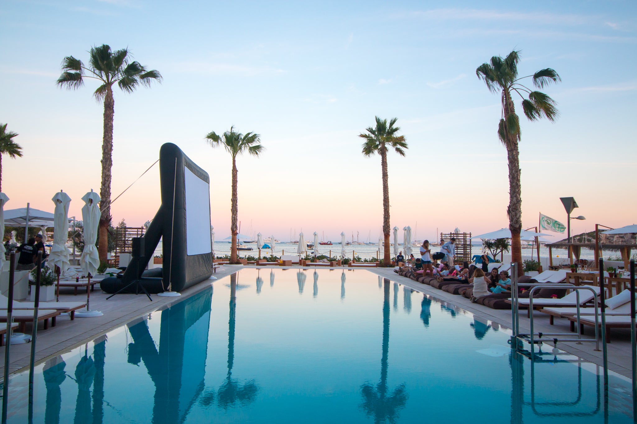 Open Air Cinema 12′ x 7′ Pro screen by the pool